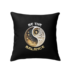 Decorative pillow with sun and moon motif for harmony.