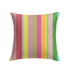 Vintage-inspired Retro Rainbow Blast Pillow on a cozy armchair.