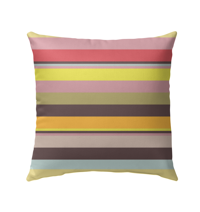 Vibrant Watercolor Strokes Stripe Outdoor Pillow on a cozy deck chair.