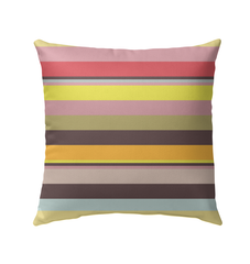 Vibrant Watercolor Strokes Stripe Outdoor Pillow on a cozy deck chair.