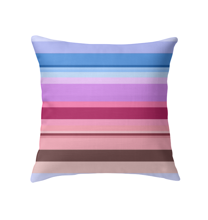 Galactic Rainbow Stripe Indoor Pillow on a modern couch.