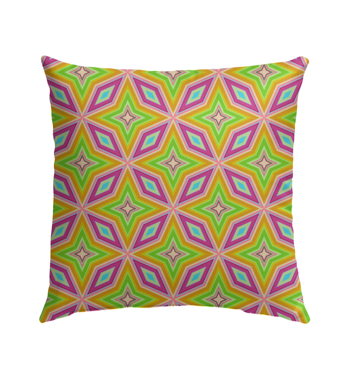 Colorful outdoor pillow with kaleidoscope pattern in garden setting.