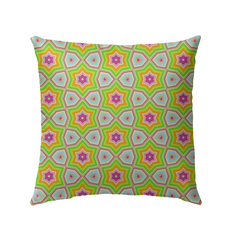 Urban Jungle patterned outdoor pillow in a garden setting