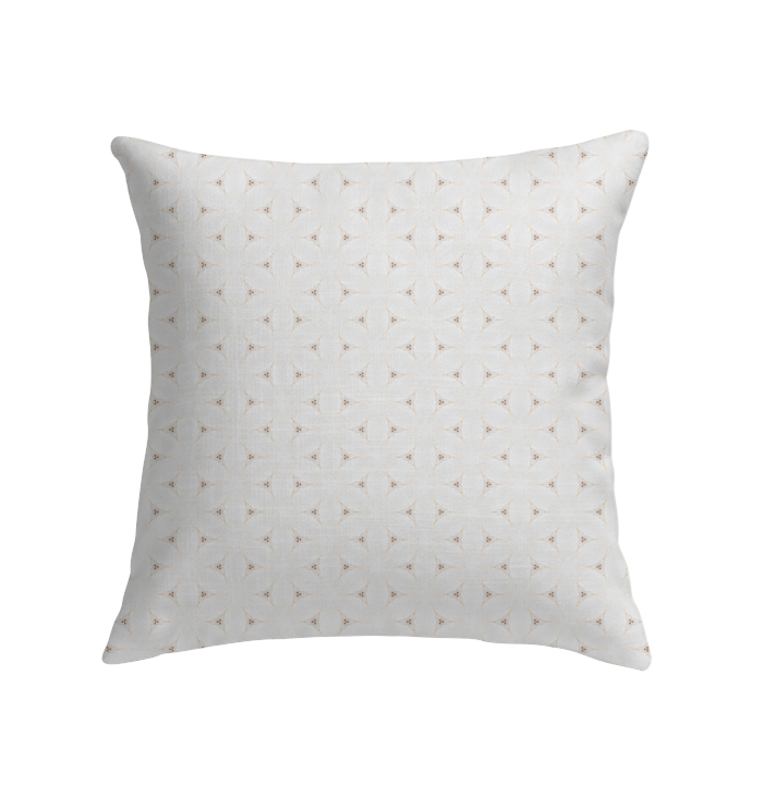 Soft and cozy Silent Snowfall Indoor Pillow on a couch.