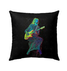 Colorful Garden Giggles pillow placed outdoors