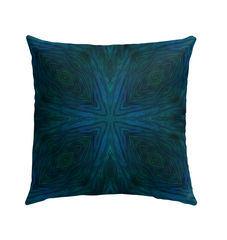 Outdoor pillow with rainbow design placed in a garden setting, enhancing outdoor decor.