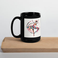 Ceramic mug with glossy finish showcasing feminine dance illustration.