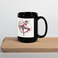 Artistic black mug with mystical dance theme for coffee enthusiasts.