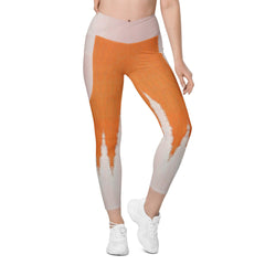 Woman wearing Orange Nova Crossover Leggings with side pockets