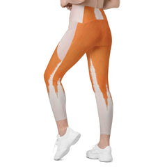 Detail view of pocket design on Orange Nova Crossover Leggings