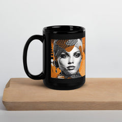 Black glossy ceramic mug by Painted Palates in natural light.