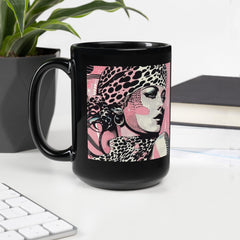 Close-up of a black glossy mug with painted designs.