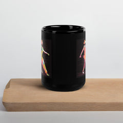 Poised ballet dancer silhouette on glossy black mug.