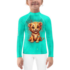 Kid surfing wearing the stylish Regal Gaze Collection rash guard.