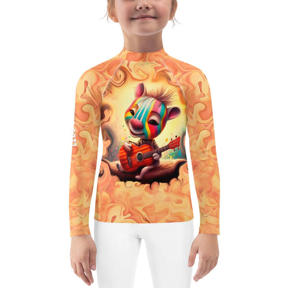 Child wearing Serene Giraffe's Glance Rash Guard at the beach.