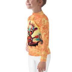 Kid running on beach in Giraffe's Glance Rash Guard.