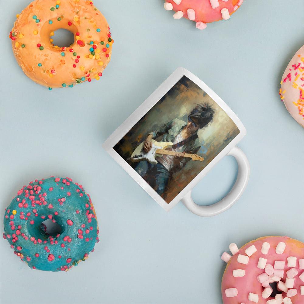 Close-up of Strumming Sorcery white mug for music lovers