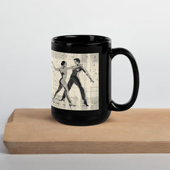 Black Glossy Mug with Balletic Theme against a dark backdrop.