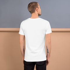 Ghostly Glow Unisex Staple T-Shirt folded on a table
