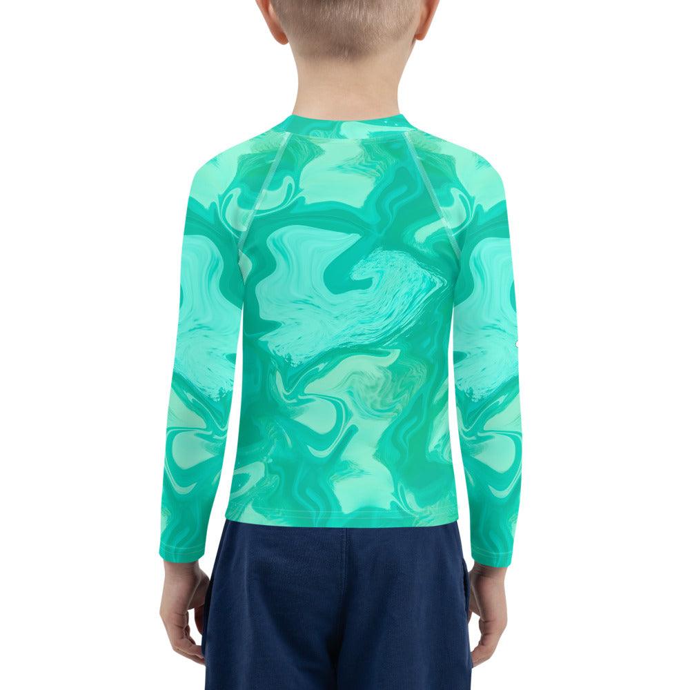 Child wearing Whimsical Pupils Delight rash guard at the beach.