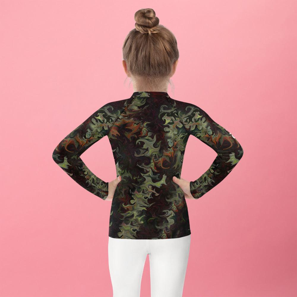Back view of child in Whimsy in Their Eyes rash guard looking at the sea.