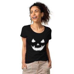 Eco-conscious woman wearing a Halloween pumpkin carving tee, bringing organic festivity to the season.