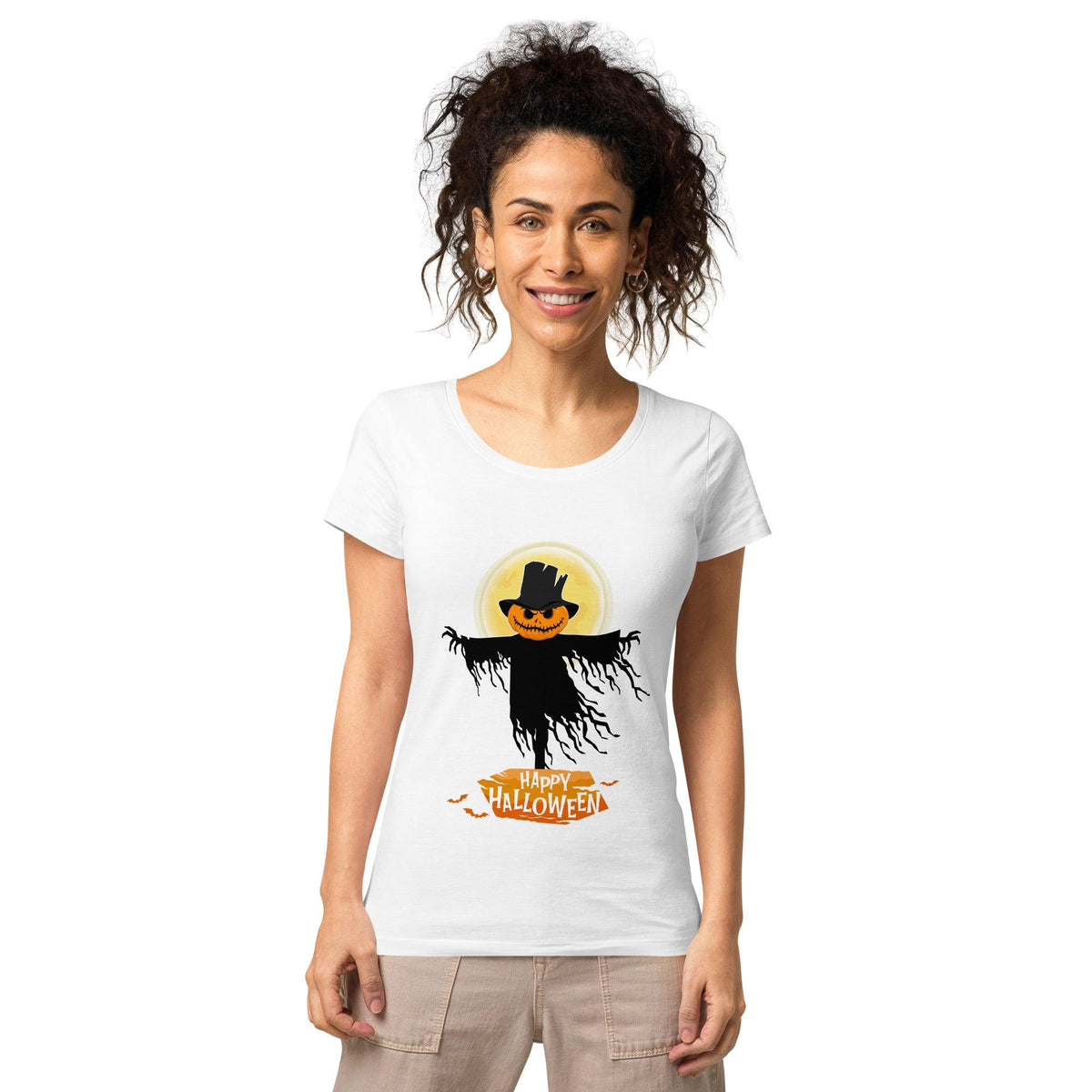 Woman wearing organic Halloween tee with haunted house design, ready for spooky festivities.
