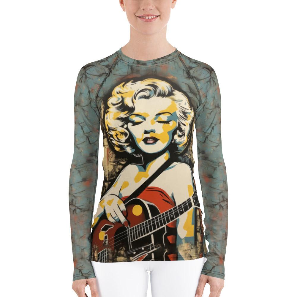 Women wearing guitar-themed rash guard at the beach